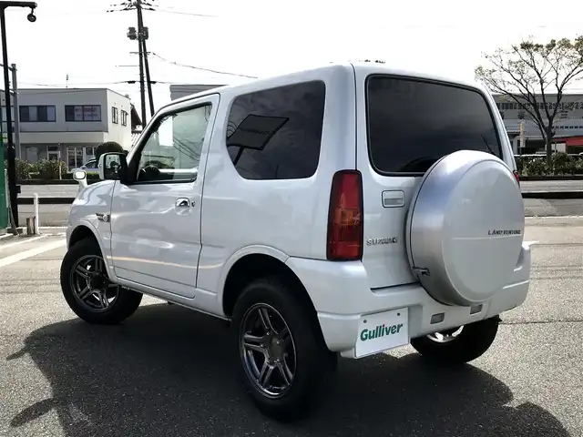 スズキ ジムニー ランドベンチャー 鳥取県 2015(平27)年 3.7万km パールホワイト ４・W・D/ターボ車/社外ナビ/フルセグ/CD/DVD/BT/ETC2.0/前後ドライブレコーダー/レザーシート/運転席シートヒーター/フォグライト/４WD切替スイッチ/背面タイヤ/キーレスキー/電動格納ミラー/ウィンカーミラー/純正16インチアルミホイール/フロアマット