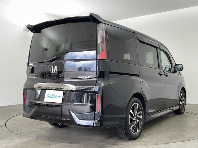 ホンダ ステップワゴン スパーダ クルスピセンシング 兵庫県 2021(令3)年 2.2万km プレミアムスパークルブラックパール ・ワンオーナー/・Honda SENSING/・衝突軽減ブレーキ/・誤発進抑制機能/・歩行者事故低減ステアリング/・路外逸脱抑制機能/・アダプディブクルーズコントロール/・車線維持支援システム/・先行車発進お知らせ機能/・標識認識機能/・純正7インチメモリナビ＆フルセグ＆BT＆USB＆DVD＆USB/・バックカメラ/・両側パワースライドドア/・パドルシフト/・前席シートヒーター/・ステアリングリモコン/・ビルトインETC2.0/・純正前後ドライブレコーダー/・純正フロアマット/・スマートキー/・スペアキー/・プッシュスタート/・W＋サイドエアバック/・カーテンエアバック/・アイドリングストップ/・横滑り防止装置/・純正17インチアルミホイール/・LEDヘッドライト/・フォグ/・オートライト/・2列目サンシェード/・FABTECT(撥水撥油シート)/・コンフォートビューパッケージ（親水/ヒーテッドドアミラー＋フロントドア撥水ガラス）
