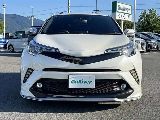 トヨタ Ｃ－ＨＲ ハイブリッド 1．8G 奈良県 2017(平29)年 5.6万km ホワイトパールクリスタルシャイン モデリスタフルエアロ/純正ナビ（NSZT-Y66T）/（フルセグ/BT/CD/DVD）/レーダークルーズコントロール/バックカメラ/ブラインドスポットモニター/プリクラッシュセーフティ/レーンキープアシスト/前後コーナーセンサー/ハーフレザーシート/前席シートヒーター/モデリスタ19インチAW/ETC2.0/前方ドライブレコーダー/取り扱い説明書/スペアキーX1