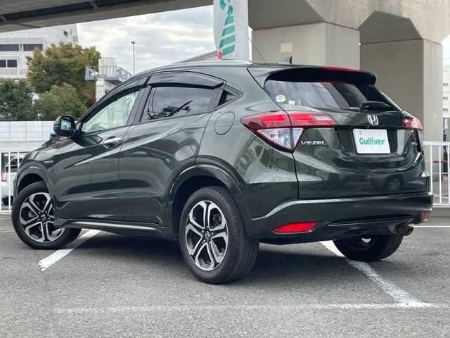 ホンダ ヴェゼル ハイブリッド Z 神奈川県 2014(平26)年 15.6万km ミスティックグリーンパール ワンオーナー/純正メモリナビ/・DTV/CD/DVD/BT/USB/HDMI/バックカメラ/レザーシート/前席シートヒーター/ビルトインETC/ルーフレール/クリアランスソナー/シティブレーキアクティブシステム/リアクティブフォースペダル/クルーズコントロール/車両接近通報装置/盗難防止装置/パドルシフト付き革巻きステアリング/純正17インチAW/オートライト/純正LEDヘッドライト/フォグランプ/アイドリングストップ/プッシュEgスタート/ストップ/スマートキー×2/ターンランプ付電動格納ドアミラー/ヒーテッドドアミラー/ドアバイザー/純正フロアマット/取扱説明書/新車時保証書