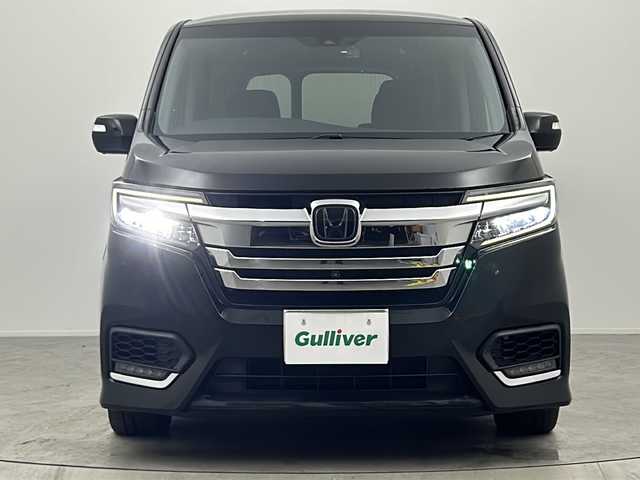 ホンダ ステップワゴン スパーダ ハイブリッド G EX ホンダセンシング 大阪府 2017(平29)年 5.7万km プレミアムスパークルブラックパール 純正9インチインターナビ/・フルセグTV/・Bluetooth/・CD/DVD/・FM/AM/・HDMI/社外後席フリップダウンモニター/ホンダセンシング/衝突軽減ブレーキ/誤発進抑制装置/後方誤発進抑制機能/路外逸脱抑制機能/アダプティブクルーズコントロール/車線維持支援システム/先行車発進お知らせ機能/オートハイビーム/パーキングセンサー/パーキングアシスト/両側パワースライドドア/ハーフレザーシート/シートヒーター/シートバックテーブル/ロールサンシェード/LEDヘッドライト/スマートキー