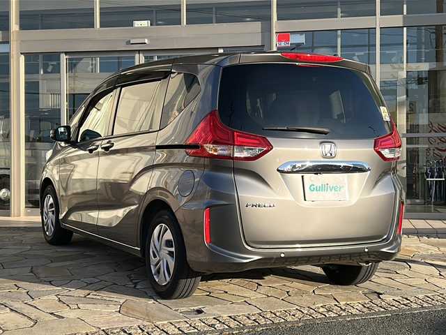 ホンダ フリード G ホンダセンシング 静岡県 2021(令3)年 2.3万km シルバー 純正SDナビ（AM.FM.CD.DVD.ワンセグTV.Bluetooth）/両側パワースライドドア/バックカメラ/アイドリングストップ/レーダークルーズコントロール/プッシュスタート/ドライブレコーダー/ETC/純正ホイールキャップ/レーンキープアシスト/スマートキー/スペアキー/ステアリングリモコン　/衝突軽減システム/横滑り防止装置/オートライト/盗難防止装置/純正フロアマット/ウォークスルー