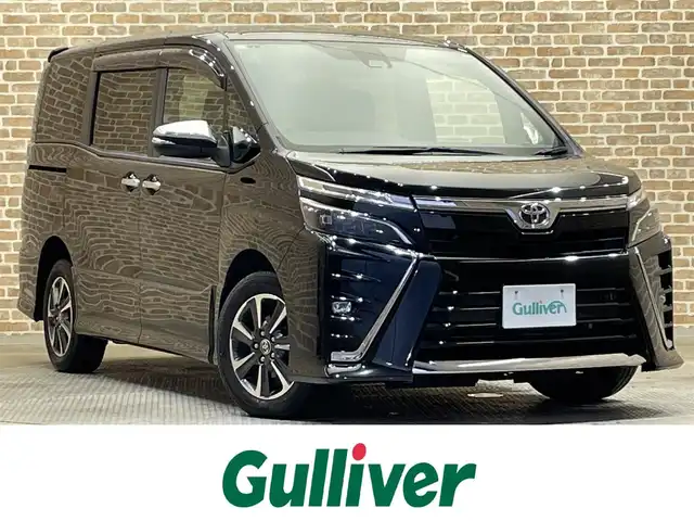 トヨタ ヴォクシー ZS 煌Ⅲ 岩手県 2021(令3)年 7.2万km ブラック 4WD/社外9インチナビ/トヨタセーフティセンス/衝突軽減ブレーキ/クルーズコントロール/レーンキープアシスト/両側パワースライドドア/バックカメラ/社外フリップダウンモニター/ハーフレザーシート/ドライブレコダー/ワイパーデアイサー/ビルトインETC/アイドリングストップ/電動格納ドアミラー/ステアリングリモコン/純正16インチアルミホイール/寒冷地仕様/マニュアルモード付オートマチックトランスミッション/LEDヘッドライト/オートライト