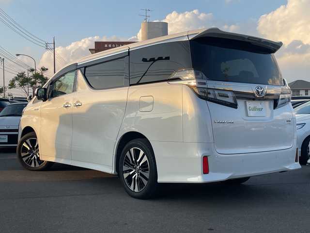トヨタ ヴェルファイア ハイブリット ZR 山口県 2019(令1)年 2.6万km ホワイトパールクリスタルシャイン ＡＬＰＩＮＥ１１インチナビ　/AM/FM/CD/DVD/Bluetooth/フルセグTV/ＡＬＰＩＮＥ１２．８型フリップダウンモニター　/全方位カメラ　/両側パワースライドドア　/電動リアゲート　/黒革シート/シートベンチレーション/レーダークルーズコントロール　/前席、2列目パワーシート/三眼ＬＥＤヘッドライト　/クリアランスソナー/レーンキープアシスト/衝突被害軽減ブレーキ/純正１８インチアルミホイール/ＥＴＣ　/ドライブレコーダー