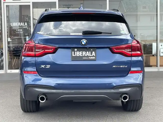 ＢＭＷ Ｘ３ xDrive20d Mスポーツ 岐阜県 2020(令2)年 3.4万km ファイトニックブルー ドライビング・アシスト・プラス/ アクティブ・クルーズ・コントロール/ ステアリング&レーンコントロールアシスト/ レーン・ディパーチャーウォーニング/ レーンチェンジウォーニング/ アクティブ・サイドコリジョンプロテクション/ 前車接近警告機能/ 衝突回避・被害軽減ブレーキ/ 事故回避アシスト/ 後車衝突警告機能/ クロス・トラフィック・ウォーニング（フロント&リヤ）/パーキング・アシスト・プラス/ パークディスタンスコントロール/ パーキング・アシスト（並列・縦列）/ トップ・ビュー/ サイド・ビュー・カメラ / リヤ・ビュー・カメラ/ヘッドアップディスプレイ/アダプティブLEDヘッドライト/ LEDハイ／ロービーム/ LEDフロントターンインジケータ/ コーナリングライト/ ハイビームアシスタント/BMWライブ・コックピット/ 12.3インチ マルチディスプレイメーターパネル/ 10.25インチワイドコントロールディスプレイ/ HDDナビゲーション・システム/ 電動フロント・シート/ フロント・シート・ヒーティング/スクリーンミラーリング/パドルシフト/ミラー一体ＥＴＣ/パワーバックドア