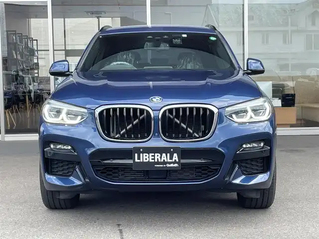 ＢＭＷ Ｘ３ xDrive20d Mスポーツ 岐阜県 2020(令2)年 3.4万km ファイトニックブルー ドライビング・アシスト・プラス/ アクティブ・クルーズ・コントロール/ ステアリング&レーンコントロールアシスト/ レーン・ディパーチャーウォーニング/ レーンチェンジウォーニング/ アクティブ・サイドコリジョンプロテクション/ 前車接近警告機能/ 衝突回避・被害軽減ブレーキ/ 事故回避アシスト/ 後車衝突警告機能/ クロス・トラフィック・ウォーニング（フロント&リヤ）/パーキング・アシスト・プラス/ パークディスタンスコントロール/ パーキング・アシスト（並列・縦列）/ トップ・ビュー/ サイド・ビュー・カメラ / リヤ・ビュー・カメラ/ヘッドアップディスプレイ/アダプティブLEDヘッドライト/ LEDハイ／ロービーム/ LEDフロントターンインジケータ/ コーナリングライト/ ハイビームアシスタント/BMWライブ・コックピット/ 12.3インチ マルチディスプレイメーターパネル/ 10.25インチワイドコントロールディスプレイ/ HDDナビゲーション・システム/ 電動フロント・シート/ フロント・シート・ヒーティング/スクリーンミラーリング/パドルシフト/ミラー一体ＥＴＣ/パワーバックドア
