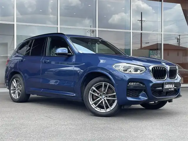 ＢＭＷ Ｘ３ xDrive20d Mスポーツ 岐阜県 2020(令2)年 3.4万km ファイトニックブルー ドライビング・アシスト・プラス/ アクティブ・クルーズ・コントロール/ ステアリング&レーンコントロールアシスト/ レーン・ディパーチャーウォーニング/ レーンチェンジウォーニング/ アクティブ・サイドコリジョンプロテクション/ 前車接近警告機能/ 衝突回避・被害軽減ブレーキ/ 事故回避アシスト/ 後車衝突警告機能/ クロス・トラフィック・ウォーニング（フロント&リヤ）/パーキング・アシスト・プラス/ パークディスタンスコントロール/ パーキング・アシスト（並列・縦列）/ トップ・ビュー/ サイド・ビュー・カメラ / リヤ・ビュー・カメラ/ヘッドアップディスプレイ/アダプティブLEDヘッドライト/ LEDハイ／ロービーム/ LEDフロントターンインジケータ/ コーナリングライト/ ハイビームアシスタント/BMWライブ・コックピット/ 12.3インチ マルチディスプレイメーターパネル/ 10.25インチワイドコントロールディスプレイ/ HDDナビゲーション・システム/ 電動フロント・シート/ フロント・シート・ヒーティング/スクリーンミラーリング/パドルシフト/ミラー一体ＥＴＣ/パワーバックドア