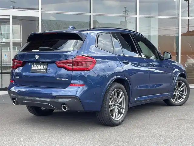 ＢＭＷ Ｘ３ xDrive20d Mスポーツ 岐阜県 2020(令2)年 3.4万km ファイトニックブルー ドライビング・アシスト・プラス/ アクティブ・クルーズ・コントロール/ ステアリング&レーンコントロールアシスト/ レーン・ディパーチャーウォーニング/ レーンチェンジウォーニング/ アクティブ・サイドコリジョンプロテクション/ 前車接近警告機能/ 衝突回避・被害軽減ブレーキ/ 事故回避アシスト/ 後車衝突警告機能/ クロス・トラフィック・ウォーニング（フロント&リヤ）/パーキング・アシスト・プラス/ パークディスタンスコントロール/ パーキング・アシスト（並列・縦列）/ トップ・ビュー/ サイド・ビュー・カメラ / リヤ・ビュー・カメラ/ヘッドアップディスプレイ/アダプティブLEDヘッドライト/ LEDハイ／ロービーム/ LEDフロントターンインジケータ/ コーナリングライト/ ハイビームアシスタント/BMWライブ・コックピット/ 12.3インチ マルチディスプレイメーターパネル/ 10.25インチワイドコントロールディスプレイ/ HDDナビゲーション・システム/ 電動フロント・シート/ フロント・シート・ヒーティング/スクリーンミラーリング/パドルシフト/ミラー一体ＥＴＣ/パワーバックドア