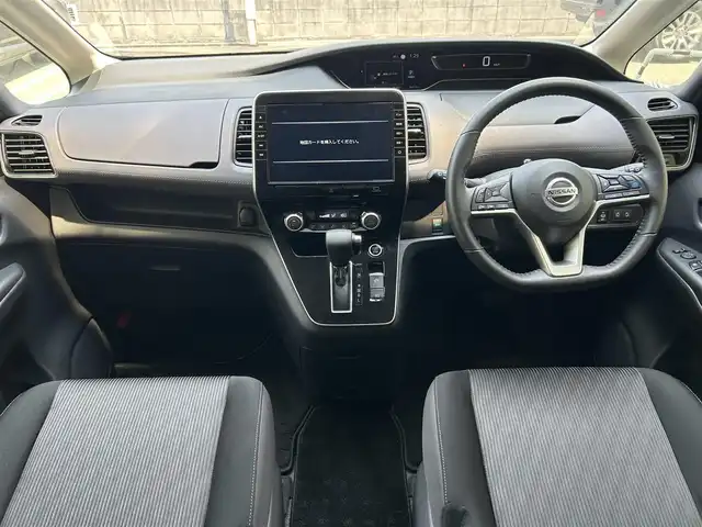 日産 セレナ ハイウェイスター V 兵庫県 2022(令4)年 3万km ダークメタルグレー 純正１０インチナビ(CD/DVD/BT/TV)/フルセグTV/アラウンドビューモニター/プロパイロット/フリップダウンモニター/デジタルインナーミラー/ステアリングリモコン/クルーズコントロール（追従あり）/レーンキープアシスト/オートライト/両側パワースライドドア/ビルドインETC/衝突被害軽減システム/プッシュスタート/リアサンシェード/純正フロアマット/ドアバイザー/LEDヘッドライト/コーナーセンサー/純正16インチアルミホイール/スペアキー1本