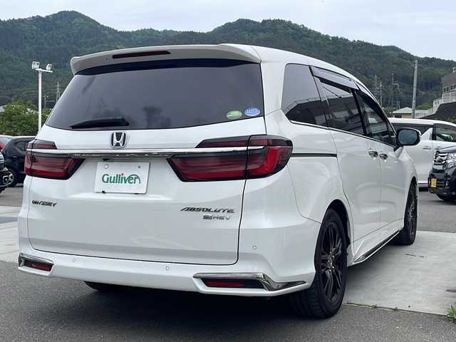 ホンダ オデッセイ ハイブリッド e:HEVアブソルート EX 山梨県 2021(令3)年 3.8万km プラチナホワイトパール フルセグテレビ/ホンダセンシング/両側パワースライドドア/純正10インチナビ/100V電源/衝突軽減装置/全周囲カメラ/前シートヒーター/パワーシート/オットマン/ETC/LEDヘッドライト/黒合革シート/ブラインドスポットモニター/オートマチックハイビーム/デュアルエアコン/革巻きステアリング