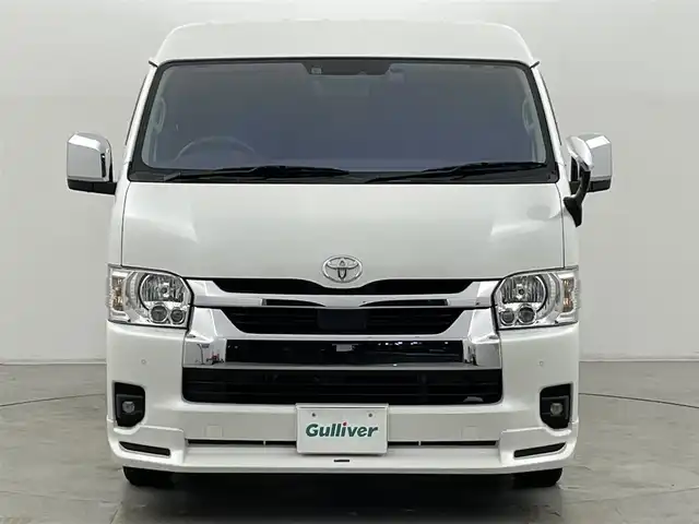 トヨタ ハイエース GL 群馬県 2023(令5)年 2.1万km ホワイトパールクリスタルシャイン パノラミックビューモニター/デジタルインナーミラー/パワースライドドア（挟み込み防止機能）/モデリスタエアロ/LEDヘッドライト/純正15インチアルミホイール/AC100V電源/純正フリップダウンモニター/純正7インチナビ（AM/FM/CD/DVD/SD/Bluetooth/フルセグTV）/片側パワースライドドア/トヨタセーフティセンス/プリクラッシュセーフティ/レーンディパーチャーアラート/オートマチックハイビーム/クリアランスソナー/パーキングサポートブレーキ/ステアリングスイッチ/純正ドライブレコーダー/純正ビルトインETC2.0/プッシュスタート/スマートキー