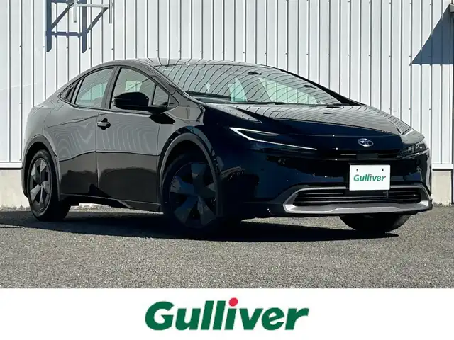 トヨタ プリウス U 熊本県 2024(令6)年 1.4万km アティチュードブラックマイカ 純正ディスプレイオーディオ/・AM/FM/BT/USB/Miracast/・フルセグTV/・バックカメラ/トヨタセーフティセンス/・レーンディパーチャーアラート/・プリクラッシュセーフティ/・パーキングサポートブレーキ/・クリアランスソナー/・ロードサインアシスト/革巻きステアリング/・ステアリングスイッチ/レーダークルーズコントロール/ETC2.0/ヘッドライトレべライザー/オートハイビーム/電動格納ミラー/・ウィンカーミラー/・オートリトラミラー/スマートキー/EVモード/ECOモード/POWERモード