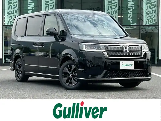 ホンダ ステップワゴン スパーダ eHEV 岡山県 2025(令7)年 0.1万km未満 クリスタルブラックパール 登録時走行距離5km/登録済未使用車/純正11.4インチナビ/フルセグTV/(AM.FM.TV.CD.DVD.BT)/両側パワースライドドア/フロントセンサーカメラ/バックビューモニター/シートヒーター/レーダークルーズコントロール/クリアランスソナー/衝突軽減ブレーキ/オットマン/電動リアゲート/レーンキープアシスト/フルフラットシート/カーテンエアバック/１６インチ純正AW