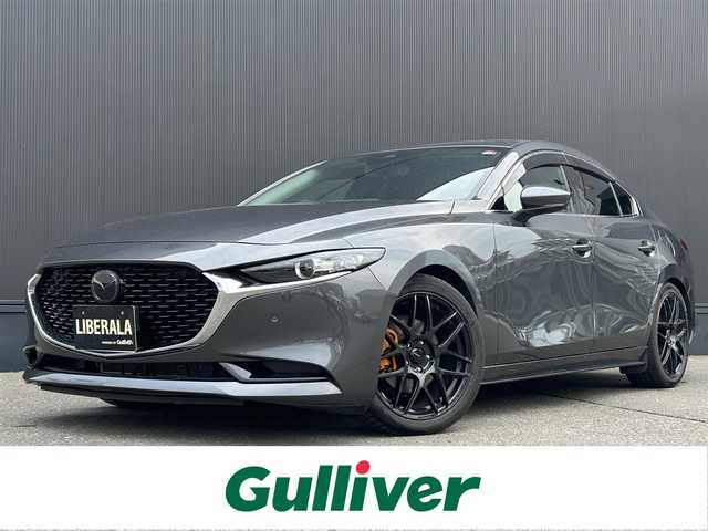 マツダ マツダ３セダン 15S ツーリング 道東・釧路十勝 2020(令2)年 3万km マシーングレープレミアムM ・ワンオーナー/・４WD/・寒冷地仕様/・純正SDナビ/・CD/DVD/BT/USB/HDMI/フルセグ/・バックカメラ/・ヘッドアップディスプレイ/・i-ACTIVSENSE/・アドバンスト・スマート・シティ・ブレーキ・サポート/・レーンキープアシスト/・レーダークルーズコントロール/・クリアランスソナー/・横滑り防止装置/・ブラインドスポットモニタリング/・ハイビーム・コントロール・システム/・アダプティブ・フロントライティング・システム/・LEDヘッドライト/・社外18インチAW/・純正フロアマット/・純正エンジンスターター/・プッシュスタート/・スマートキー/・取扱説明書/・保証書