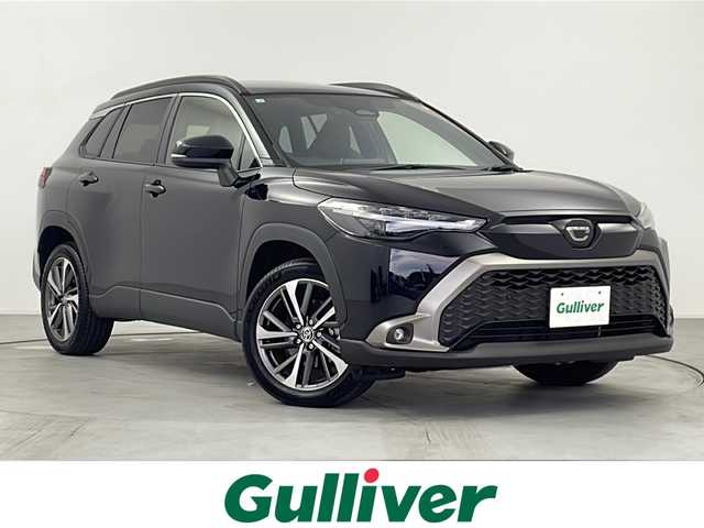 トヨタ カローラ クロス ハイブリッド Z 愛知県 2025(令7)年 0.4万km アティチュードブラックマイカ 純正ナビ/パノラマルーフ/バックカメラ/フルセグTV・Bluetooth・USB/ETC2.0ビルトイン/ハンズフリーパワーバックドア/ルーフレール/本革＋ファブリックシート/運転席パワーシート/運転席助手席シートヒーター/運転席電動ランバーサポート/トヨタセーフティセンス/プリクラッシュセーフティ/レーントレーシングアシスト/レーンディパーチャーアラート/レーダークルーズコントロール/オートマチックハイビーム/ロードサインアシスト/ドライバー異常時対応システム/プロアクティブドライビングアシスト/発進遅れ告知/車両接近通報/パーキングサポートブレーキ/ドライブモード(エコ・ノーマル・パワー・EV)/革巻きステアリング/ステアリングスイッチ/スマートキー/プッシュスタート/イモビライザー/スペアキー