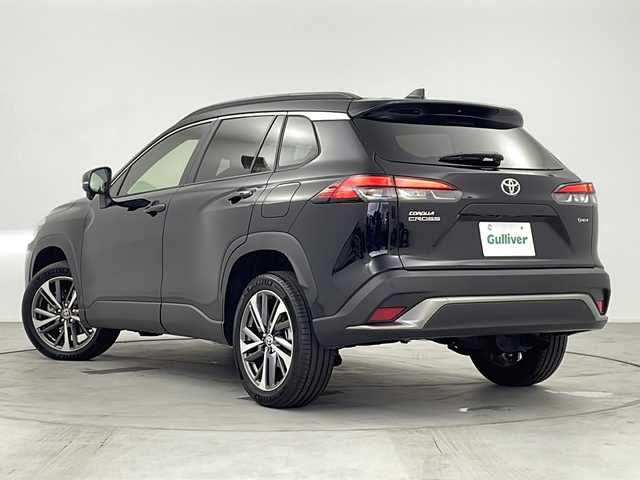 トヨタ カローラ クロス ハイブリッド Z 愛知県 2025(令7)年 0.4万km アティチュードブラックマイカ 純正ナビ/パノラマルーフ/バックカメラ/フルセグTV・Bluetooth・USB/ETC2.0ビルトイン/ハンズフリーパワーバックドア/ルーフレール/本革＋ファブリックシート/運転席パワーシート/運転席助手席シートヒーター/運転席電動ランバーサポート/トヨタセーフティセンス/プリクラッシュセーフティ/レーントレーシングアシスト/レーンディパーチャーアラート/レーダークルーズコントロール/オートマチックハイビーム/ロードサインアシスト/ドライバー異常時対応システム/プロアクティブドライビングアシスト/発進遅れ告知/車両接近通報/パーキングサポートブレーキ/ドライブモード(エコ・ノーマル・パワー・EV)/革巻きステアリング/ステアリングスイッチ/スマートキー/プッシュスタート/イモビライザー/スペアキー