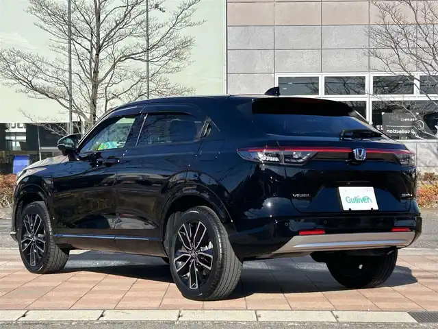 ホンダ ヴェゼル ハイブリッド e:HEV Z 福島県 2023(令5)年 1.2万km クリスタルブラックパール ホンダセンシング/衝突軽減ブレーキ/アダプティブクルーズコントロール/車線維持支援システム/誤発進抑制機能/後方誤発進抑制機能/路外逸脱抑制機能/先行車発進お知らせ機能/標識認識機能/オートハイビーム/ブラインドスポットインフォメーション/純正ナビゲーション/型番：VXU-225VZi/【CD/DVD/SD/USB/Bluetooth/TV】/バックカメラ/純正前後ドライブレコーダー/ビルトインETC/おくだけ充電/電動リフトゲート/前席シートヒーター/ステアリングヒーター/パドルシフト/ステアリングリモコン/LEDオートライト/LEDフォグランプ/純正フロアマット/ドアバイザー