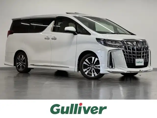 トヨタ アルファード S Cパッケージ 三重県 2021(令3)年 2.8万km ホワイトパールクリスタルシャイン 法人１オーナー車　/JBLプレミアムサウンド　/純正10.5型ナビ（BD/TV/BT/CarPlay/AndroidAuto）　/13.3型 リアエンターテインメントシステム　/全周囲カメラ　/モデリスタエアロ（F/S/R下）&スポーツマフラー（純正品あり）/両側電動スライド　/ツインムーンルーフ　/3眼LEDヘッドライト　/デジタルインナーミラー　/シートヒーター / ベンチレーション（D/N）　/エグゼクティブパワーシート（N/2nd電動リクライニング/オットマン）　/AC100V アクセサリーコンセント　/パワーバックドア　/TOYOTA Safety Sense　/　・PCS　衝突被害軽減　/　・LTA　レーントレーシングアシスト　/　・BSM　ブラインドスポットモニター　/　・レーダークルーズ　/　・IPA2　インテリジェントパーキングアシスト2　/　・クリアランスソナー　/　・RCTA　リヤクロストラフィックアラート　/　・PKSB　パーキングサポートブレーキ　/　・RSA　ロードサインアシスト　/　・AHS　アダプティブハイビーム　/　・TMN　先行車発進告知機能　/ビルトイン ETC2.0　/純正18inAW　/保/取　/予備キーx1　
