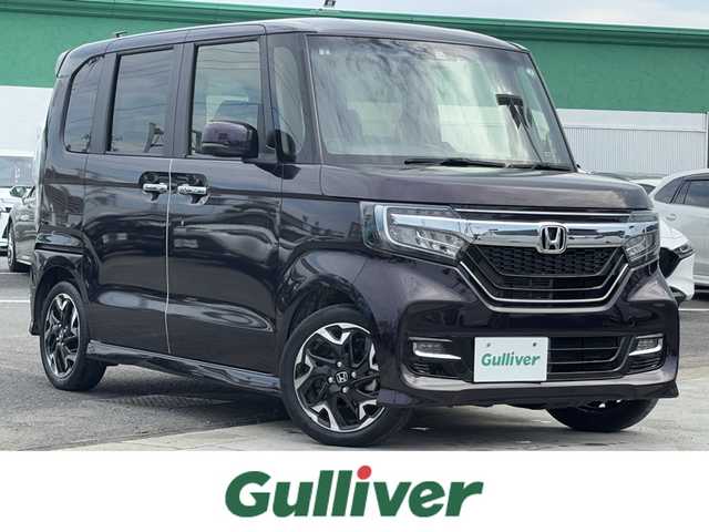 ホンダ Ｎ ＢＯＸ カスタム G L ターボ ホンダセンシング 徳島県 2020(令2)年 1.2万km プレミアムベルベットパープル・パール 純正ギャザーズナビ VXM-204VFi/(AM.FM.CD.DVD.BT.フルセグ.SD)/純正前後ドライブレコーダー/ホンダセンシング/・アダプティブ・クルーズ・コントロール（ACC）/・車線維持支援システム（LKAS）/・衝突軽減ブレーキ（CMBS）/・誤発進抑制機能（前進）/・歩行者事故低減ステアリング/・路外逸脱抑制機能/・先行車発進お知らせ機能/・標識認識機能/・オートハイビーム/・誤発進抑制機能（後進）/両側パワースライドドア/バックカメラ/黒革ハーフレザーシート/パドルシフト/ＬＥＤヘッドライト/ビルトインＥＴＣ/純正アルミホイール/ＵＳＢ充電２口