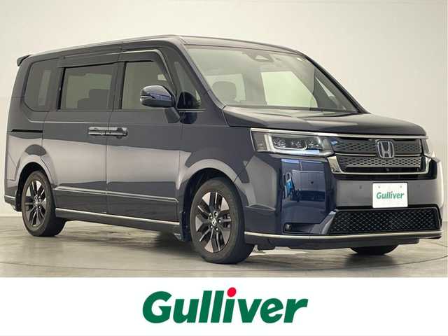 ホンダ ステップワゴン スパーダ eHEV 滋賀県 2022(令4)年 3.9万km モーニングミストブルーM 禁煙車/純正11.4型ナビ/【CD/DVD/Bluetooth/フルセグTV//AppleCarPlay/AndroidAuto】/純正フリップダウンモニター/マルチビューカメラ/ETC2.0/前後ドライブレコーダー/両側パワースライドドア/ホンダセンシング/●衝突軽減ブレーキ/●誤発進抑制機能/●後方誤発進抑制機能/●近距離衝突軽減ブレーキ/●歩行者事故低減ステアリング/●路外逸脱抑制機能/●渋滞追従機能付アダプティブクルーズコントロール/●車線維持支援システム/●トラフィックジャムアシスト/●先行車発進お知らせ機能/●標識認識機能/●オートハイビーム/●アダプティブドライビングビーム/●ブラインドスポットインフォメーション/シートヒーター/パワーテールゲート/減速セレクター/オートホールド/電動パーキングブレーキ/スマートキー