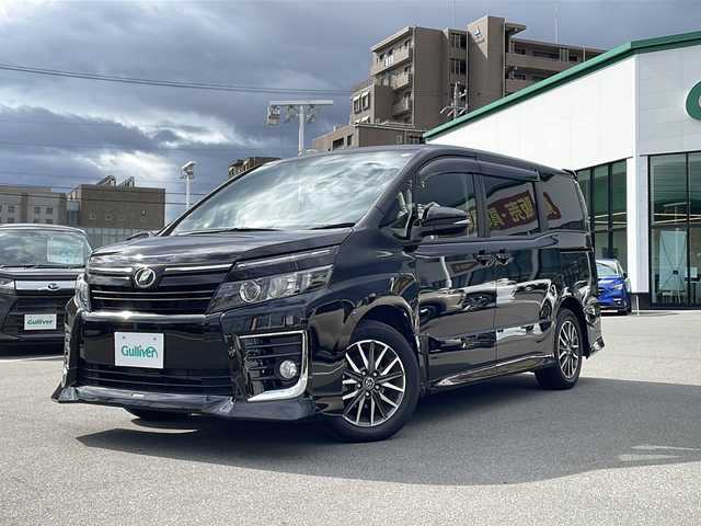 トヨタ ヴォクシー ZS 長野県 2014(平26)年 5万km ブラック TRDエアロ/純正9インチSDナビ（NSZT-Y64T）/FM・AM・DVD・CD・フルセグテレビ/Bluetooth Audio/ドライブレコーダー（YCD-18FHR）/両側パワースライドドア/レーダー探知機（YA-W17GA）/純正16インチアルミホイール/革巻きステアリング/アイドリングストップ/ステアリングスイッチ/LEDヘッドライト/オートライト/フォグランプ/純正フロアマット/ウィンカーミラー/ドアバイザー/プッシュスタート/スマートキー/ETC