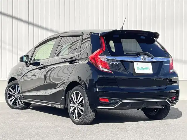 ホンダ フィット ハイブリット S ホンダセンシング 群馬県 2018(平30)年 1.7万km クリスタルブラックパール 社外メモリーナビ/（CD/Bluetooth/AYX/USB/ワンセグTV）/ホンダセンシング/・アダプティブクルーズコントロール/・CMBS（衝突軽減ブレーキ）/・誤発進抑制機能/・歩行者事故低減ステアリング/・路外逸脱抑制機能/・LKAS（車線維持支援システム）/・先行車発進お知らせ機能/・標識認識機能/パドルシフト/ECONモード/プッシュスタート/ステアリングリモコン/LEDヘッドランプ/リアスポイラー/ステンレス製スポーツペダル/グレー柄入りブラックファブリックシート