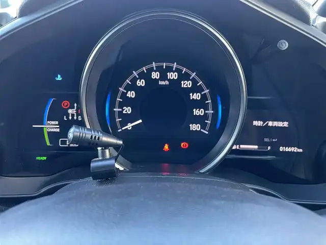 ホンダ フィット ハイブリット S ホンダセンシング 群馬県 2018(平30)年 1.7万km クリスタルブラックパール 社外メモリーナビ/（CD/Bluetooth/AYX/USB/ワンセグTV）/ホンダセンシング/・アダプティブクルーズコントロール/・CMBS（衝突軽減ブレーキ）/・誤発進抑制機能/・歩行者事故低減ステアリング/・路外逸脱抑制機能/・LKAS（車線維持支援システム）/・先行車発進お知らせ機能/・標識認識機能/パドルシフト/ECONモード/プッシュスタート/ステアリングリモコン/LEDヘッドランプ/リアスポイラー/ステンレス製スポーツペダル/グレー柄入りブラックファブリックシート