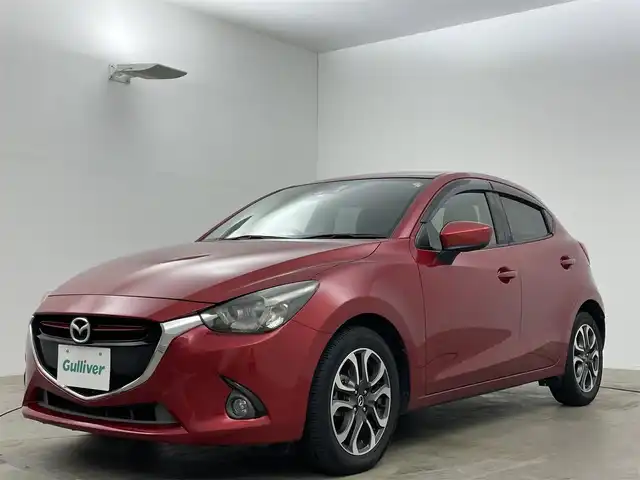 マツダ デミオ XD ツーリング 岡山県 2016(平28)年 8万km ソウルレッドプレミアムメタリック 純正ナビ/・FM/AM/Bluetooth/フルセグ/CD/DVD/バックカメラ/セーフティパッケージ/・ブラインドスポットモニター/・ハイビームコントロールシステム/・車線逸脱警報システム/衝突軽減システム/クルーズコントロール/シートヒーター/パドルシフト/ETC/純正18インチアルミ/純正フロアマット