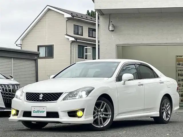トヨタ クラウン アスリート i－Four 宮城県 2010(平22)年 14.6万km ホワイトパールクリスタルシャイン 純正ナビ/フルセグＴＶ/TRD　sportivoエアロ/ＡＭ／ＦＭ／ＣＤ／ＤＶＤ／ＵＳＢ　/クルーズコントロール/横滑り防止装置/アイドリングストップ/前席シートヒーター/前席パワーシート/オートライト（ＬＥＤ）　/スペアキー×１/スマートキー/社外フロアマット