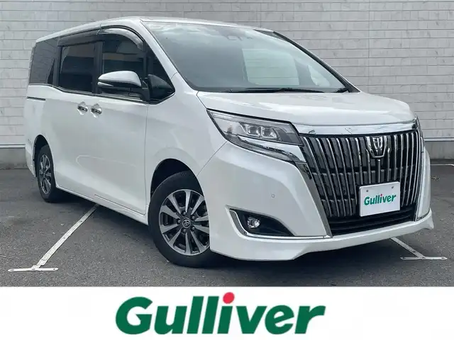 トヨタ エスクァイア Gi 静岡県 2019(令1)年 2.7万km ホワイトパールクリスタルシャイン 社外8インチメモリナビ（AM/FM/CD/DVD）/フルセグTV/Bluetooth接続/トヨタセーフティセンス/レーンキープアシスト/プリクラッシュセーフティ/オートマチックハイビーム/LEDヘッドライト/クルーズコントロール/バックカメラ/アイドリングストップ/両側パワースライドドア/レザーシート/ビルトインETC/前後ドライブレコーダー/レザーシート/前席シートヒーター/純正15インチアルミホイール/横滑り防止装置/純正フロアマット/取扱説明書