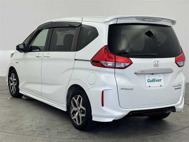 ホンダ フリード ハイブリット モデューロX ホンダセンシング 愛知県 2018(平30)年 7.1万km ホワイトオーキッドパール ホンダセンシング/　　・衝突軽減ブレーキシステム/　　・誤発進抑制機能/　　・歩行者事故低減ステアリング/　　・路外逸脱抑制機能/　　・アダプティブクルーズコントロール/　　・車線維持支援システム/純正7インチナビ　/　　・CD/DVD/BT/フルセグ/バックカメラ/ビルトインETC/革巻きステアリング/ステアリングリモコン/ハーフレザーシート/キャプテンシート/両側パワースライドドア/無限15インチアルミホイール/純正LEDヘッドライト/フォグランプ/取扱説明書/保証書