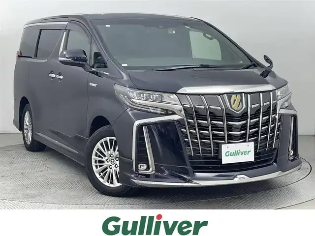 トヨタ アルファードハイブリット S タイプゴールド 道央・札幌 2020(令2)年 5.1万km スパークリングブラックパールクリスタルシャイン ・４WD/・モデリスタエアロ（F/S/R）/・モデリスタマフラー/・純正ディスプレイオーディオ/　CD/DVDデッキ/TVキット/BT/USB/Miracast/・バックカメラ/・前後ドライブレコーダー/・AC100V/1500W/・トヨタセーフティセンス/　PCS/LTA/PKSB/RSA/・レーダークルーズコントロール/・クリアランスソナー/・オートハイビーム/・両側パワースライドドア/・パワーバックドア/・LEDヘッドライト/・フォグライト/・オートライト/・ハーフレザーシート/・2列目オットマン/・純正AW/・純正フロアマット/・ドアバイザー