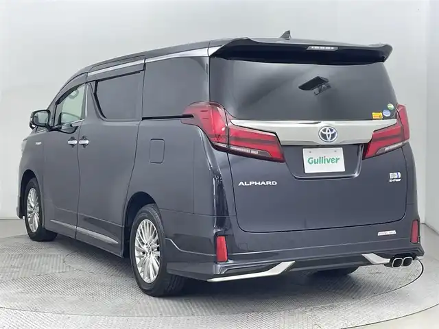トヨタ アルファードハイブリット S タイプゴールド 道央・札幌 2020(令2)年 5.1万km スパークリングブラックパールクリスタルシャイン ・４WD/・モデリスタエアロ（F/S/R）/・モデリスタマフラー/・純正ディスプレイオーディオ/　CD/DVDデッキ/TVキット/BT/USB/Miracast/・バックカメラ/・前後ドライブレコーダー/・AC100V/1500W/・トヨタセーフティセンス/　PCS/LTA/PKSB/RSA/・レーダークルーズコントロール/・クリアランスソナー/・オートハイビーム/・両側パワースライドドア/・パワーバックドア/・LEDヘッドライト/・フォグライト/・オートライト/・ハーフレザーシート/・2列目オットマン/・純正AW/・純正フロアマット/・ドアバイザー