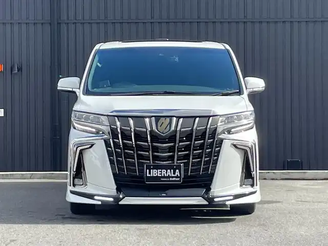 トヨタ アルファードハイブリット S タイプゴールド 福島県 2021(令3)年 7.6万km ホワイトパールクリスタルシャイン ワンオーナー/TRDエアロ/サンルーフ/レーダークルーズコントロール/プリクラッシュセーフティ/レーンキープ/ブラインドスポット/オートマチックハイビーム/デジタルインナーミラー/三眼LEDヘッドライト/純正ナビ/フルセグTV/バックカメラ/フリップダウンモニター/ビルトインETC/パワーバックドア/前後ドライブレコーダー/社外GPSレーダー/純正エンジンスターター/オートホールド/コーナーセンサー/ヒッチメンバー/純正17インチAW/取扱説明書/保証書/スペアキー