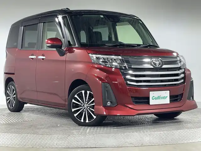 トヨタ ルーミー カスタムG－T 神奈川県 2021(令3)年 2.2万km ブラックマイカメタリック/ファイアークォーツレッドメタリック 純正9型SDナビゲーション【NSZT-Y68T】/AM FM Bluetooth フルセグ HDMI CD DVD USB/バックカメラ/両側パワースライドドア/純正フリップダウンモニター/スマートアシスト/衝突回避支援ブレーキ機能/車線逸脱警報機能/衝突警報機能/ふらつき警報/ブレーキ制御付誤発進抑制機能/サイドビューランプ/先行車発進お知らせ機能/コーナーセンサー/アダプティブクルーズコントロール/アダプティブドライビングビーム/路側逸脱警報/標識認識機能/前方ドライブレコーダー/革巻きステアリング/ステアリングリモコン/シートヒーター/電子パーキングブレーキ/オートホールド/ビルトインETC2.0/純正フロアマット/プッシュスタート/スマートキー/スペアキー/純正15インチアルミホイル/LEDヘッドライト/オートライト/オートマチックハイビーム/ドアバイザー