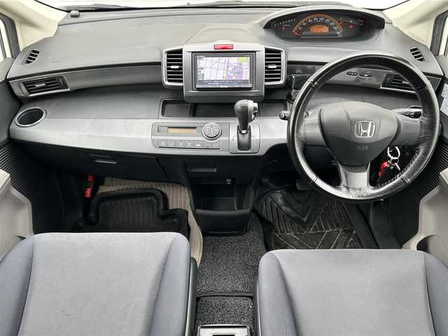 ホンダ フリード G ジャストセレクション 新潟県 2010(平22)年 10.4万km プレミアムホワイトパール 社外ナビ【フルセグTV/FM・AM/】/バックカメラ/後席モニター/ETC/ドライブレコーダー/片側パワースライドドア/スペアキー2本/純正フロアマット/HIDヘッドライト