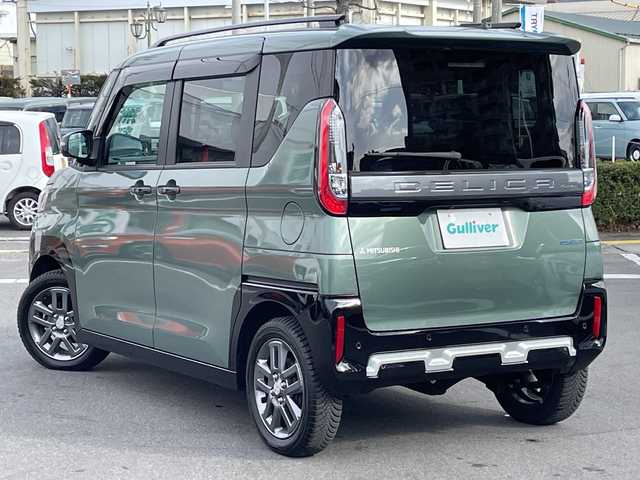 三菱 デリカミニ T プレミアム 長野県 2023(令5)年 0.4万km ＤグリーンＭ 禁煙車/純正9インチナビ/【MM223D-LM】/(フルセグTV/Bluetooth)/e-Assist/・衝突被害軽減ブレーキ/・踏み間違い衝突防止アシスト/・車線逸脱防止支援機能/・オートマチックハイビーム/・ふらつき警報/・前方衝突予測警報/・標識検知システム/・先行車発進通知/・マイパイロット（レーダークルーズコントロール・車線維持支援）/デジタルルームミラー/マルチアラウンドモニター/ビルトインETC/ハンズフリー両側パワースライドドア/前席シートヒーター/ハーフレザーシート/ステアリングヒーター/革巻きステアリング/パドルシフト/ステアリングスイッチ/電動パーキングブレーキ/ブレーキホールド/LEDヘッドライト/オートライト/スマートキー/Pスタート/電動格納ミラー/純正15インチAW/純正フロアマット/ルーフレール