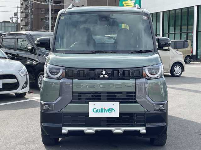 三菱 デリカミニ T プレミアム 長野県 2023(令5)年 0.4万km ＤグリーンＭ 禁煙車/純正9インチナビ/【MM223D-LM】/(フルセグTV/Bluetooth)/e-Assist/・衝突被害軽減ブレーキ/・踏み間違い衝突防止アシスト/・車線逸脱防止支援機能/・オートマチックハイビーム/・ふらつき警報/・前方衝突予測警報/・標識検知システム/・先行車発進通知/・マイパイロット（レーダークルーズコントロール・車線維持支援）/デジタルルームミラー/マルチアラウンドモニター/ビルトインETC/ハンズフリー両側パワースライドドア/前席シートヒーター/ハーフレザーシート/ステアリングヒーター/革巻きステアリング/パドルシフト/ステアリングスイッチ/電動パーキングブレーキ/ブレーキホールド/LEDヘッドライト/オートライト/スマートキー/Pスタート/電動格納ミラー/純正15インチAW/純正フロアマット/ルーフレール