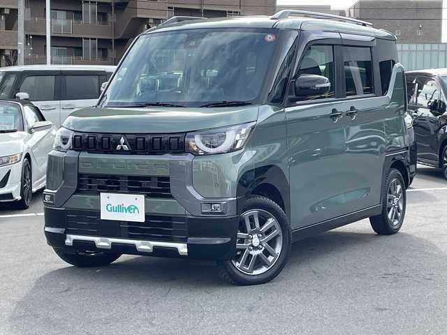 三菱 デリカミニ T プレミアム 長野県 2023(令5)年 0.4万km ＤグリーンＭ 禁煙車/純正9インチナビ/【MM223D-LM】/(フルセグTV/Bluetooth)/e-Assist/・衝突被害軽減ブレーキ/・踏み間違い衝突防止アシスト/・車線逸脱防止支援機能/・オートマチックハイビーム/・ふらつき警報/・前方衝突予測警報/・標識検知システム/・先行車発進通知/・マイパイロット（レーダークルーズコントロール・車線維持支援）/デジタルルームミラー/マルチアラウンドモニター/ビルトインETC/ハンズフリー両側パワースライドドア/前席シートヒーター/ハーフレザーシート/ステアリングヒーター/革巻きステアリング/パドルシフト/ステアリングスイッチ/電動パーキングブレーキ/ブレーキホールド/LEDヘッドライト/オートライト/スマートキー/Pスタート/電動格納ミラー/純正15インチAW/純正フロアマット/ルーフレール