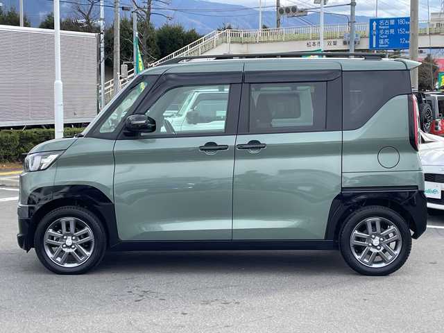 三菱 デリカミニ T プレミアム 長野県 2023(令5)年 0.4万km ＤグリーンＭ 禁煙車/純正9インチナビ/【MM223D-LM】/(フルセグTV/Bluetooth)/e-Assist/・衝突被害軽減ブレーキ/・踏み間違い衝突防止アシスト/・車線逸脱防止支援機能/・オートマチックハイビーム/・ふらつき警報/・前方衝突予測警報/・標識検知システム/・先行車発進通知/・マイパイロット（レーダークルーズコントロール・車線維持支援）/デジタルルームミラー/マルチアラウンドモニター/ビルトインETC/ハンズフリー両側パワースライドドア/前席シートヒーター/ハーフレザーシート/ステアリングヒーター/革巻きステアリング/パドルシフト/ステアリングスイッチ/電動パーキングブレーキ/ブレーキホールド/LEDヘッドライト/オートライト/スマートキー/Pスタート/電動格納ミラー/純正15インチAW/純正フロアマット/ルーフレール