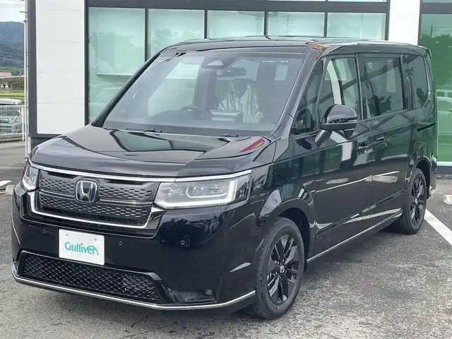 ホンダ ステップワゴン スパーダ eHEV 和歌山県 2025(令7)年 0.1万km未満 クリスタルブラックパール 純正ナビ/フルセグTV/バックカメラ/（BT/CD/DVD/USB)/衝突軽減ブレーキ/アダプティブクルーズコントロール/レーンキープ/ブラインドスポットモニター/コーナーセンサー/両側パワースライドドア/純正アルミホイール/パワーバックドア/シートヒーター/アイドリングストップ/パドルシフト/LEDヘッドライト/フォグランプ/オートライト/オートマチックハイビーム