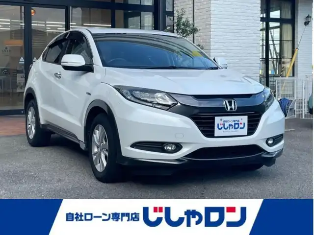 ホンダ ヴェゼル ハイブリッド X 高知県 2015(平27)年 9.2万km ホワイトオーキッドパール (株)IDOMが運営する【じしゃロン高知店】の自社ローン専用車両になります。こちらは現金またはオートローンご利用時の価格です。自社ローンご希望の方は別途その旨お申付け下さい