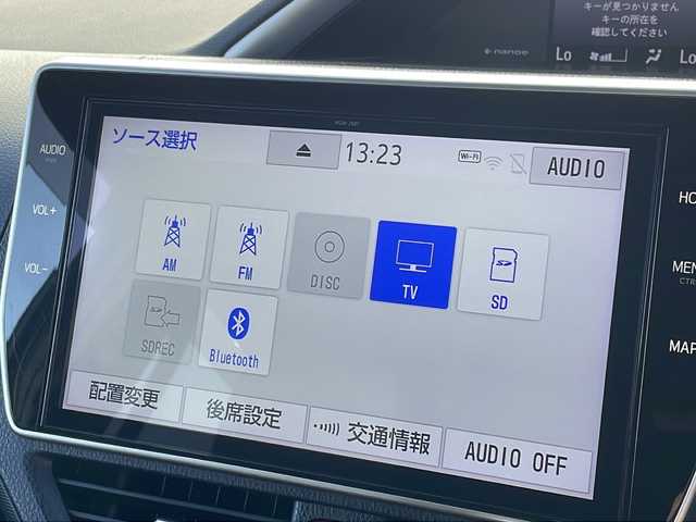 トヨタ ヴォクシー ZS 煌Ⅲ 福岡県 2021(令3)年 4.8万km ブラック 純正10インチワイドナビ/【AM/FM/CD/DVD/SD/BT/フルセグTV】/純正12インチリアフリップダウンモニター/バックカメラ/純正ドライブレコーダー/トヨタセーフティセンス/前後コーナーセンサー/ETC/両側パワースライドドア[/オートマチックハイビーム/ステアリングスイッチ/電動格納ミラー/LEDヘッドライト＆フォグランプ/ハーフレザーシート/後席サンシェード/純正ドアバイザー/スペアタイヤ