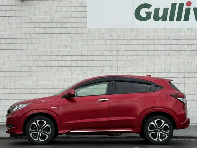 ホンダ ヴェゼル ハイブリッド 岩手県 2016(平28)年 6.3万km プレミアムクリスタルレッドM 禁煙車/4WD/ハーフレザーシート/ミラーヒーター/前席シートヒーター/クルーズコントロール/純正8インチナビ/→フルセグTV/Bluetooth/CD/DVD/HDMI/バックカメラ/ステアリングスイッチ/横滑り防止装置/電子パーキング/オートブレーキホールド/オートライト/LEDヘッドライト/LEDフォグライト/〇プッシュスタート/〇パドルシフト/〇電動格納ミラー/〇ウィンカーミラー/〇ドアバイザー/〇フロアマット/〇シガーソケット/〇USBポート/〇スマートキー/スペアキー/ビルトインETC
