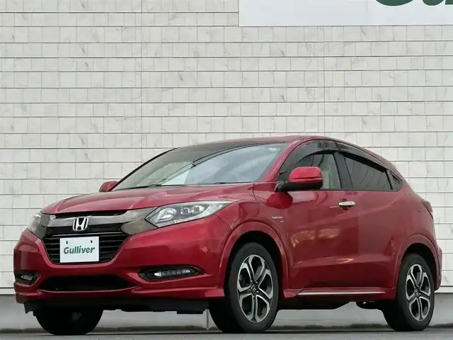 ホンダ ヴェゼル ハイブリッド 岩手県 2016(平28)年 6.3万km プレミアムクリスタルレッドM 禁煙車/4WD/ハーフレザーシート/ミラーヒーター/前席シートヒーター/クルーズコントロール/純正8インチナビ/→フルセグTV/Bluetooth/CD/DVD/HDMI/バックカメラ/ステアリングスイッチ/横滑り防止装置/電子パーキング/オートブレーキホールド/オートライト/LEDヘッドライト/LEDフォグライト/〇プッシュスタート/〇パドルシフト/〇電動格納ミラー/〇ウィンカーミラー/〇ドアバイザー/〇フロアマット/〇シガーソケット/〇USBポート/〇スマートキー/スペアキー/ビルトインETC