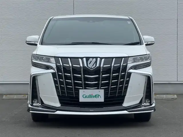 トヨタ アルファードハイブリット ロイヤルラウンジ 秋田県 2018(平30)年 9万km ホワイトパールクリスタルシャイン ４WD/JBLプレミアムサウンドシステム/24インチ液晶ディスプレイ（フルセグ）/LEDヘッドライト/両側パワスラ/純正ナビ/衝突軽減システム/ワンセグ/全方位カメラ/純正アルミ/スマートキー/純正フルエアロ/アイドリングストップ/プッシュスタート/クルーズコントロール/パーキングアシスト/レーンキープアシスト/コーナーセンサー/ステアリングスイッチ/全席シートヒーター/エアシート/全席パワーシート/メモリー付パワーシート/MTモード付AT/オットマン/集中コントロールタッチパネル/エクストラキャビネット/電動リアゲート/100V充電/ETC/ドライブレコーダー/ステアリングヒーター/純正フロアマット/純正ドアバイザー/オートライト/ダブルオートエアコン/パワーステアリング/パワーウィンドウ/横滑り防止/盗難防止装置/電動格納ウィンカーミラー/保証書/取扱説明書/記録簿