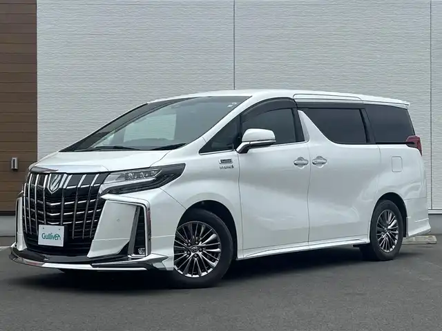 トヨタ アルファードハイブリット ロイヤルラウンジ 秋田県 2018(平30)年 9万km ホワイトパールクリスタルシャイン ４WD/JBLプレミアムサウンドシステム/24インチ液晶ディスプレイ（フルセグ）/LEDヘッドライト/両側パワスラ/純正ナビ/衝突軽減システム/ワンセグ/全方位カメラ/純正アルミ/スマートキー/純正フルエアロ/アイドリングストップ/プッシュスタート/クルーズコントロール/パーキングアシスト/レーンキープアシスト/コーナーセンサー/ステアリングスイッチ/全席シートヒーター/エアシート/全席パワーシート/メモリー付パワーシート/MTモード付AT/オットマン/集中コントロールタッチパネル/エクストラキャビネット/電動リアゲート/100V充電/ETC/ドライブレコーダー/ステアリングヒーター/純正フロアマット/純正ドアバイザー/オートライト/ダブルオートエアコン/パワーステアリング/パワーウィンドウ/横滑り防止/盗難防止装置/電動格納ウィンカーミラー/保証書/取扱説明書/記録簿