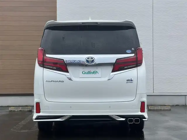 トヨタ アルファードハイブリット ロイヤルラウンジ 秋田県 2018(平30)年 9万km ホワイトパールクリスタルシャイン ４WD/JBLプレミアムサウンドシステム/24インチ液晶ディスプレイ（フルセグ）/LEDヘッドライト/両側パワスラ/純正ナビ/衝突軽減システム/ワンセグ/全方位カメラ/純正アルミ/スマートキー/純正フルエアロ/アイドリングストップ/プッシュスタート/クルーズコントロール/パーキングアシスト/レーンキープアシスト/コーナーセンサー/ステアリングスイッチ/全席シートヒーター/エアシート/全席パワーシート/メモリー付パワーシート/MTモード付AT/オットマン/集中コントロールタッチパネル/エクストラキャビネット/電動リアゲート/100V充電/ETC/ドライブレコーダー/ステアリングヒーター/純正フロアマット/純正ドアバイザー/オートライト/ダブルオートエアコン/パワーステアリング/パワーウィンドウ/横滑り防止/盗難防止装置/電動格納ウィンカーミラー/保証書/取扱説明書/記録簿