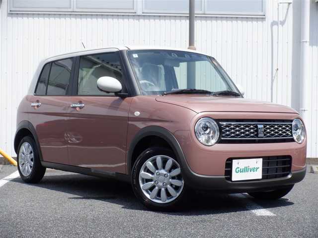 スズキ ラパン X 静岡県 2025(令7)年 0.1万km未満 テラコッタピンクメタリック/ソフトベージュ 2トーン  ワンオーナー(保証書あり）/ 走行：　4km(登録時)/ デュアルカメラブレーキサポート/ スマートキー ×2/ プッシュスタート/ 純正8インチナビ/ 全方位カメラ/ ビルトインETC/ 本革巻ステアリング/「ナノイーX」搭載フルオートエアコン/ 前席シートヒーター/ 純正14インチアルミ/ 純正LEDヘッドライト/ 純正フロアマット