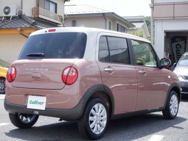 スズキ ラパン X 静岡県 2025(令7)年 0.1万km未満 テラコッタピンクメタリック/ソフトベージュ 2トーン  ワンオーナー(保証書あり）/ 走行：　4km(登録時)/ デュアルカメラブレーキサポート/ スマートキー ×2/ プッシュスタート/ 純正8インチナビ/ 全方位カメラ/ ビルトインETC/ 本革巻ステアリング/「ナノイーX」搭載フルオートエアコン/ 前席シートヒーター/ 純正14インチアルミ/ 純正LEDヘッドライト/ 純正フロアマット
